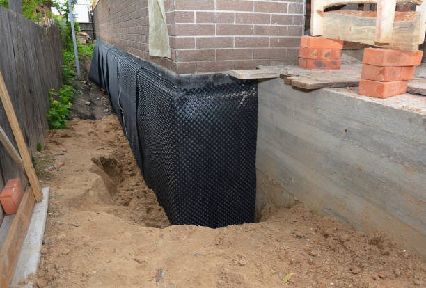 SJ Waterproofing Pros technician performing targeted Wet Basement Repair assessment in Norwalk, OH